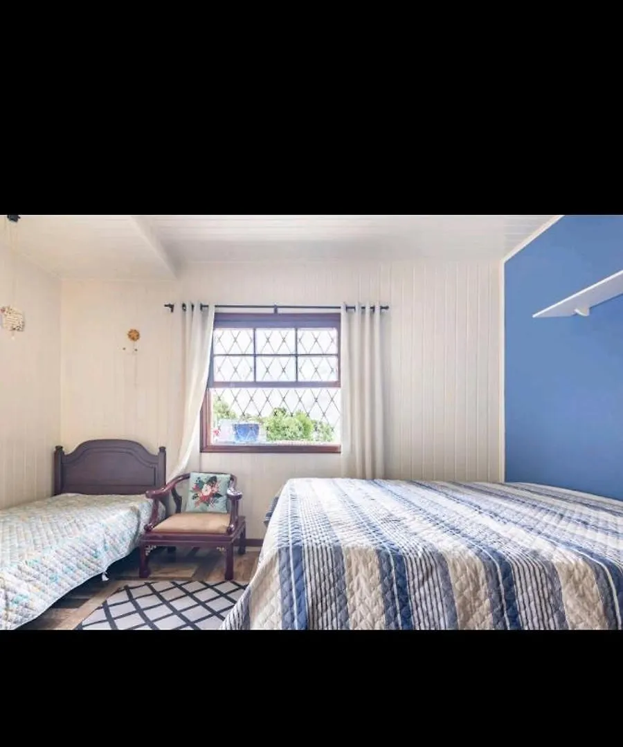 Quarto em Acomodações Particulares Suites E Quartos Casa Papai Noel Campos do Jordão